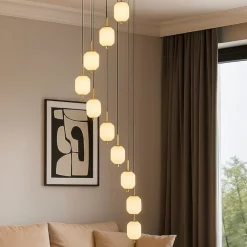 Lampadari Moderni-Selezionato da Mazzolaluce Grande lampadario a cascata per salotto moderno 9 sospensioni led cct con telecomando oro
