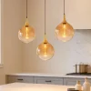 Lampadari Cucina-Selezionato da Mazzolaluce Lampadario da cucina moderna 3 vetri ambra sfere led 3000k