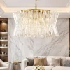 Lampadari Moderni-Selezionato da Mazzolaluce Lampadario dorato di cristalli trasparenti per salone