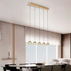 Lampadari Moderni-Selezionato da Mazzolaluce Lampadario elegante oro per tavolo da soggiorno sfere vetro