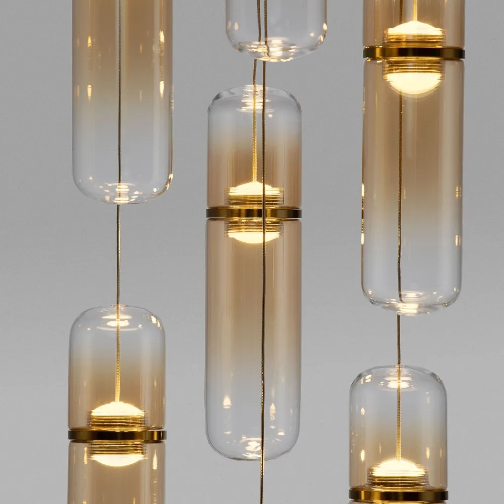 Lampadari Moderni-Selezionato da Mazzolaluce Lampadario elegante per soggiorno moderno capsule in vetro ambra led biemissione