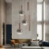 Lampadari Moderni-Selezionato da Mazzolaluce Lampadario marrone con sfere in vetro per soggiorno moderno