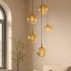 Lampadari Moderni-Selezionato da Mazzolaluce Lampadario moderno 5 luci sfera in vetro ambra led 3000k