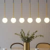 Lampadari Moderni-Selezionato da Mazzolaluce Lampadario nero oro sfere di vetro bianco per tavolo soggiorno