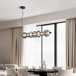 Lampadari Moderni-Selezionato da Mazzolaluce Lampadario orizzontale moderno con sfere di vetro per soggiorno