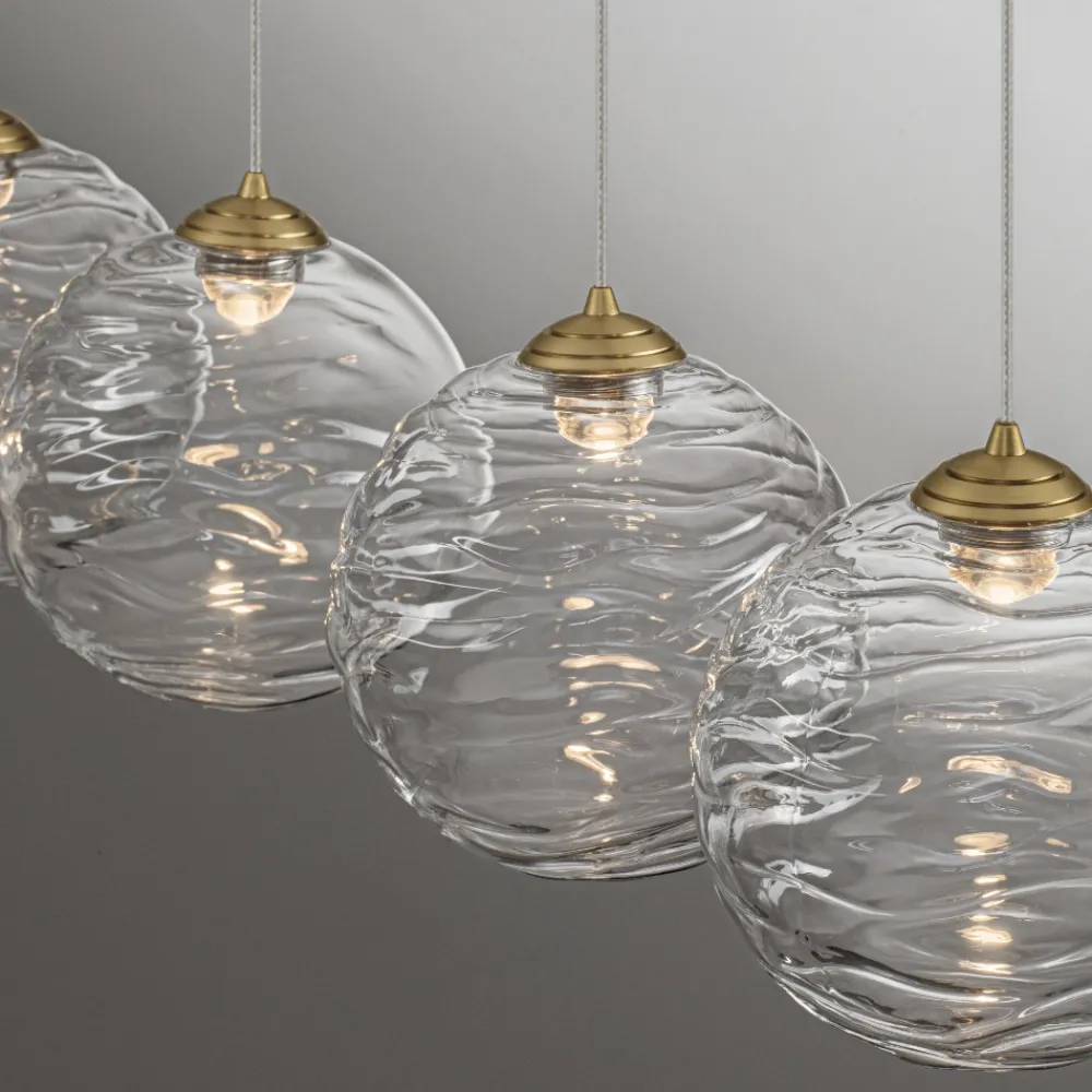 Lampadari Moderni-Selezionato da Mazzolaluce Lampadario oro con pendenti sfere di vetro ondulato trasparente per sala da pranzo