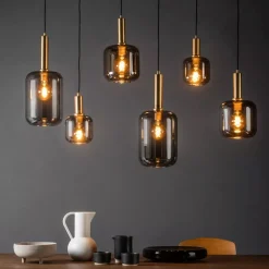 Lampadari Moderni-Selezionato da Mazzolaluce Lampadario oro sfere di vetro fume pendenti per sala da pranzo