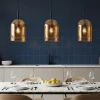Lampadari Cucina-Selezionato da Mazzolaluce Lampadario per isola cucina doppi vetri ambra 3 luci