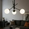 Lampadari Moderni-Selezionato da Mazzolaluce Lampadario per salotto moderno nero sfere vetro bianco