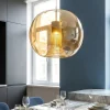 Lampadari Moderni-Selezionato da Mazzolaluce Lampadario sfera di vetro ambra trasparente struttura oro