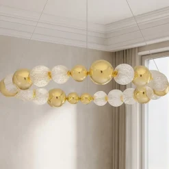 Lampadari Moderni-Selezionato da Mazzolaluce Lampadario sfere oro trasparenti per soggiorno moderno
