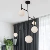Lampadari Moderni-Selezionato da Mazzolaluce Lampadario verticale sfere vetro design nero per soggiorno