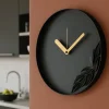 Orologi Da Parete Moderni-Selezionato da Mazzolaluce Orologio nero da parete design rotondo con foglie