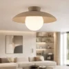 Plafoniere Moderne-Selezionato da Mazzolaluce Plafoniera da soffitto disco in metallo sabbia sfera in vetro