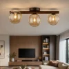 Plafoniere Moderne-Selezionato da Mazzolaluce Plafoniera da soffitto in legno stile nordico sfere di vetro ambra per cucina