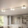 Plafoniere Moderne-Selezionato da Mazzolaluce Plafoniera marrone lunga 200 cm moderna con sfere in vetro per soggiorno
