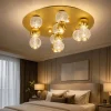 Plafoniere Moderne-Selezionato da Mazzolaluce Plafoniera per camera da letto sfere oro trasparenti contemporanea
