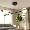 Plafoniere Moderne-Selezionato da Mazzolaluce Plafoniera per soggiorno contemporaneo nero oro con sfere led 3000k